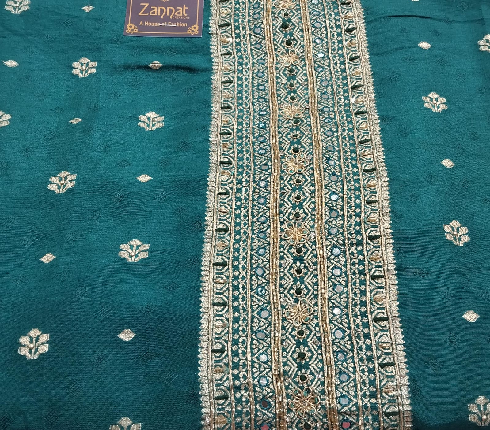 pure banarasi very beautiful silk suit with neck embroidery highlighted on it pure banarasi very beautiful silk suit with neck embroidery highlighted on it