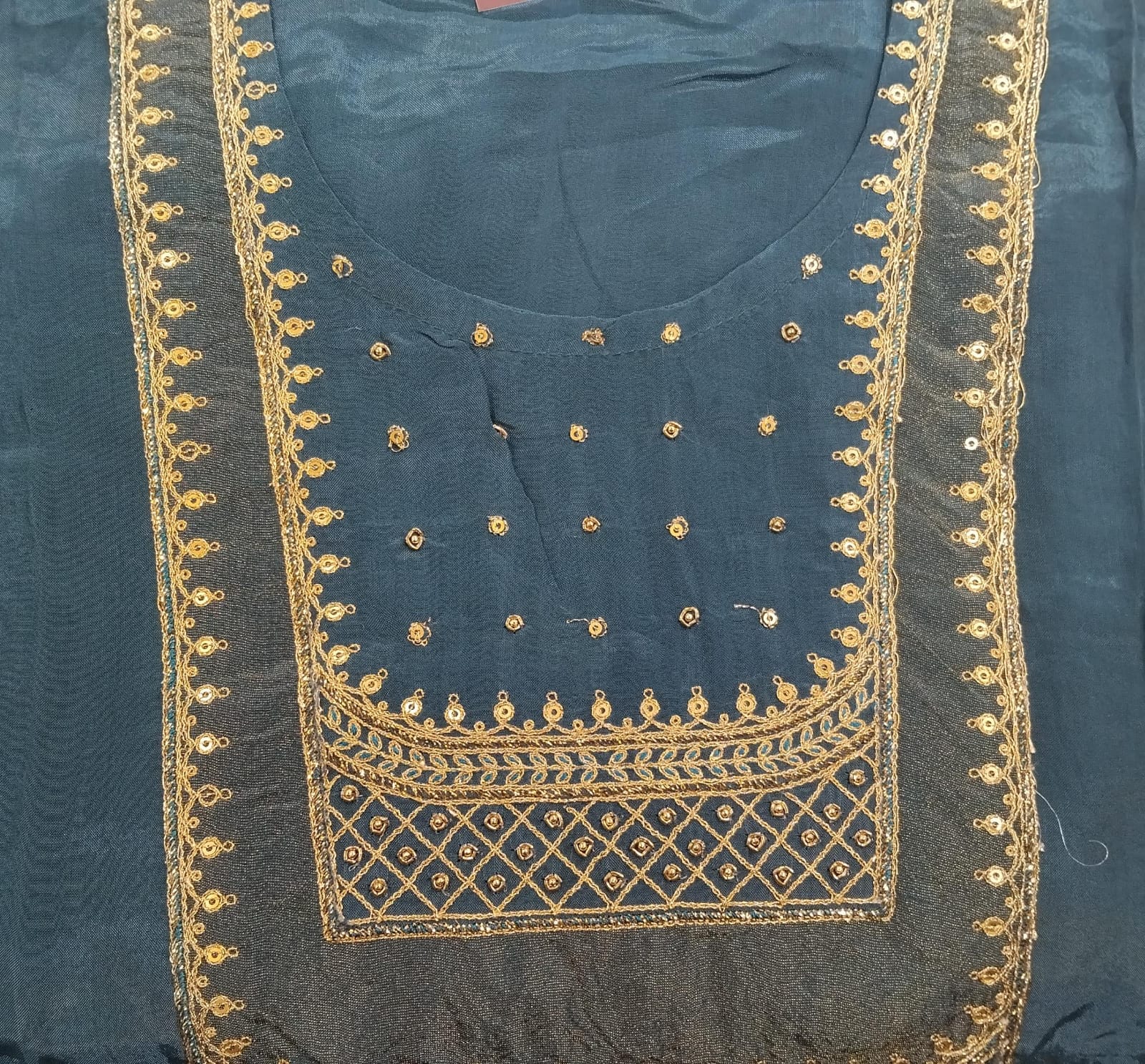 pure silk suit with zari detailing on neck with sequence highlighted pure silk suit with zari detailing on neck with sequence highlighted