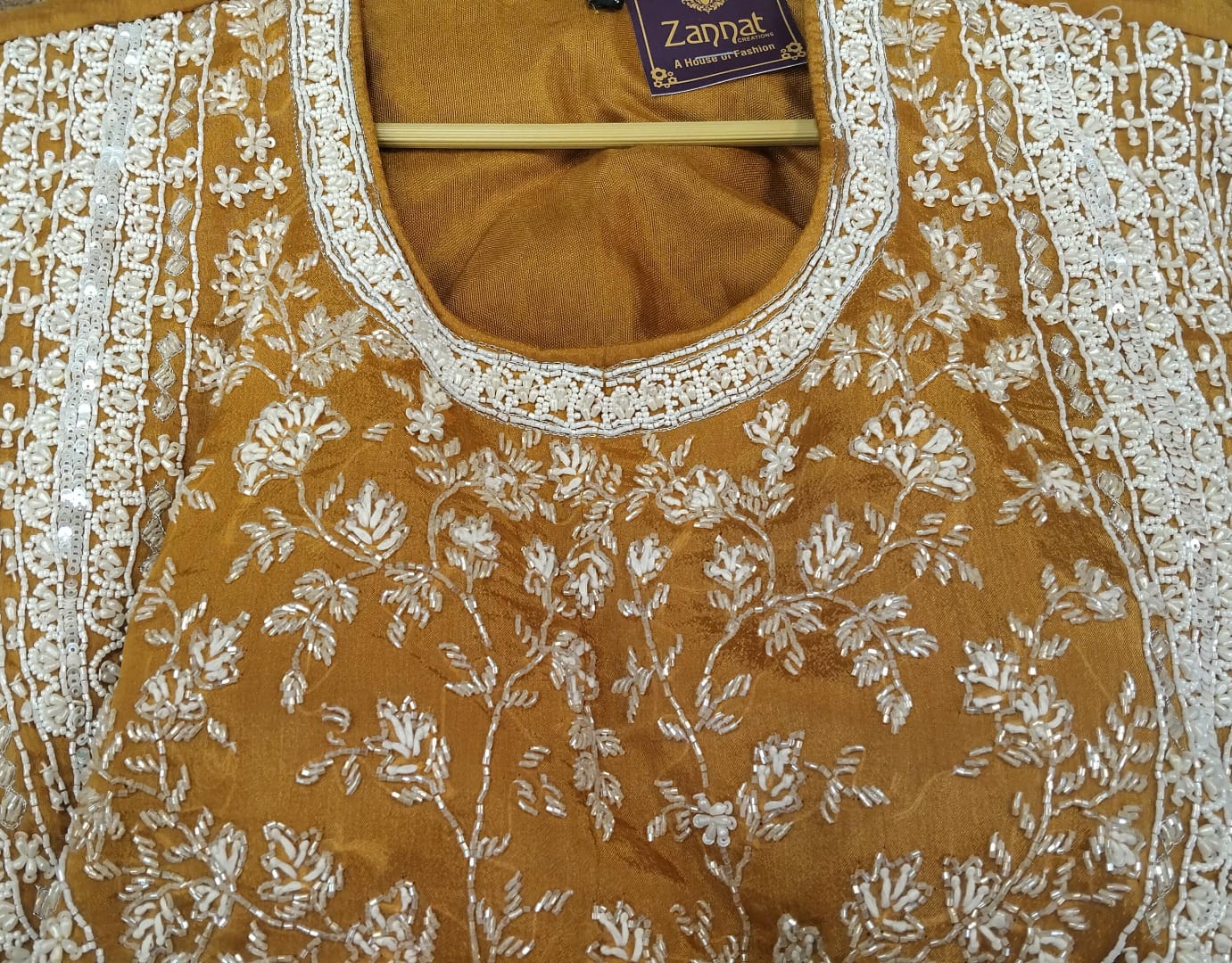 short shirt : pure chinon fabric with cut dana , sequence, french knot, pearls and siroski detailing on neck short shirt : pure chinon fabric with cut dana , sequence, french knot, pearls and siroski detailing on neck