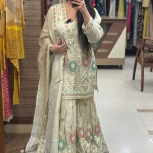 pure tissue silk fabric with siroski and gota pati detailing on all over also thread detailing flowers with back dori and tessls on neck