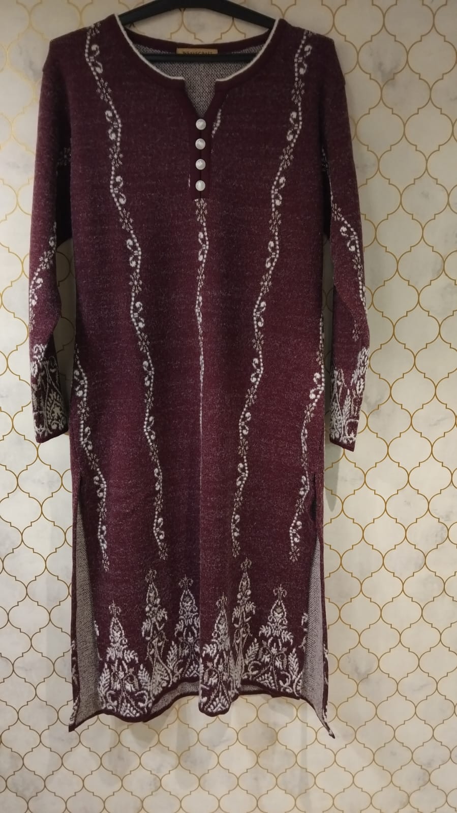 kurti pure woollen strip print and also print in hemline and sleaves with cute buttons on neck kurti pure woollen strip print and also print in hemline and sleaves with cute buttons on neck